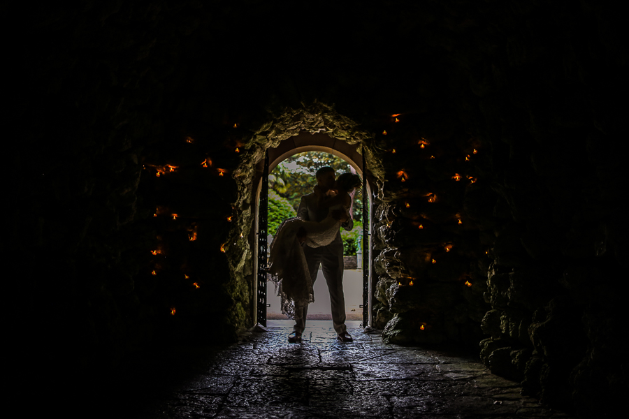 Bride and groom in cave at the Italian Villa Poole
