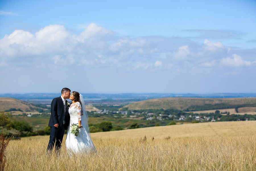 Bride and groom in golden field