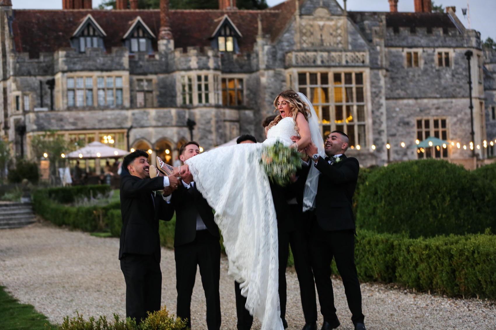 Bride thrown in air photographed by joe weil Dorset wedding photographer