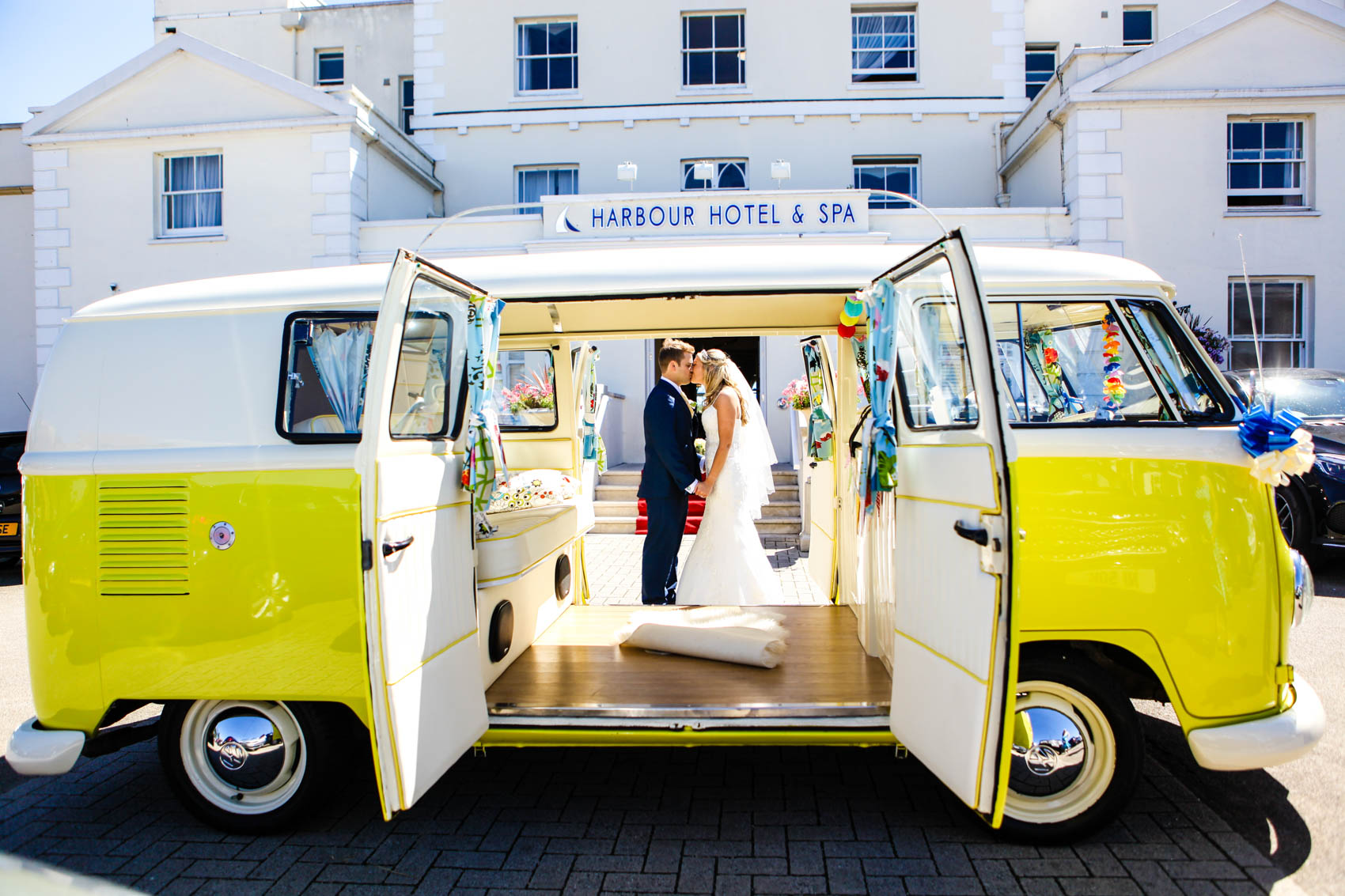 Yellow VW campervan bride and groom photo