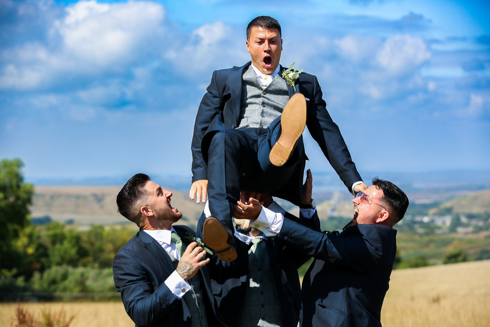 Groom being thrown in the air