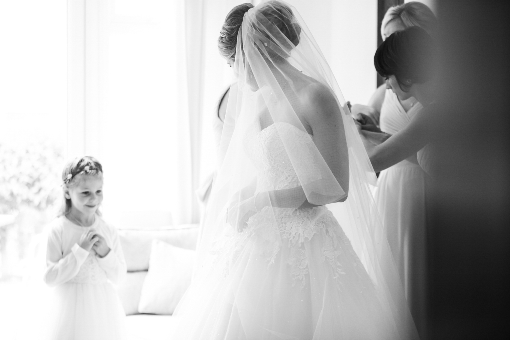 Bride with f;lower girl getting ready for the wedding