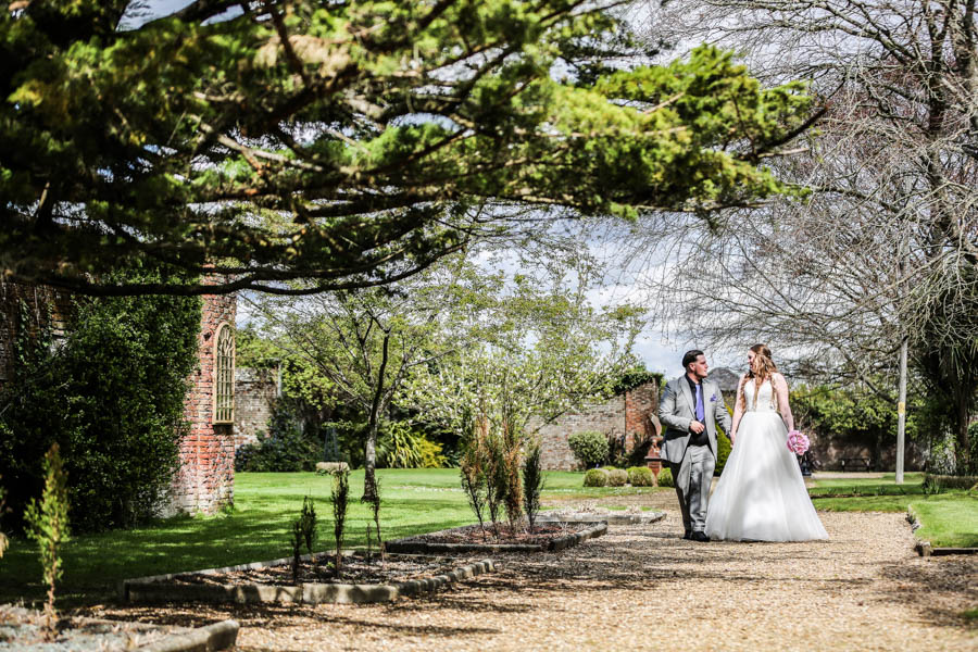 Bride and groom by Tree