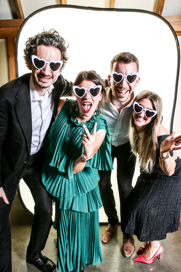Friend at a wedding in a photo booth