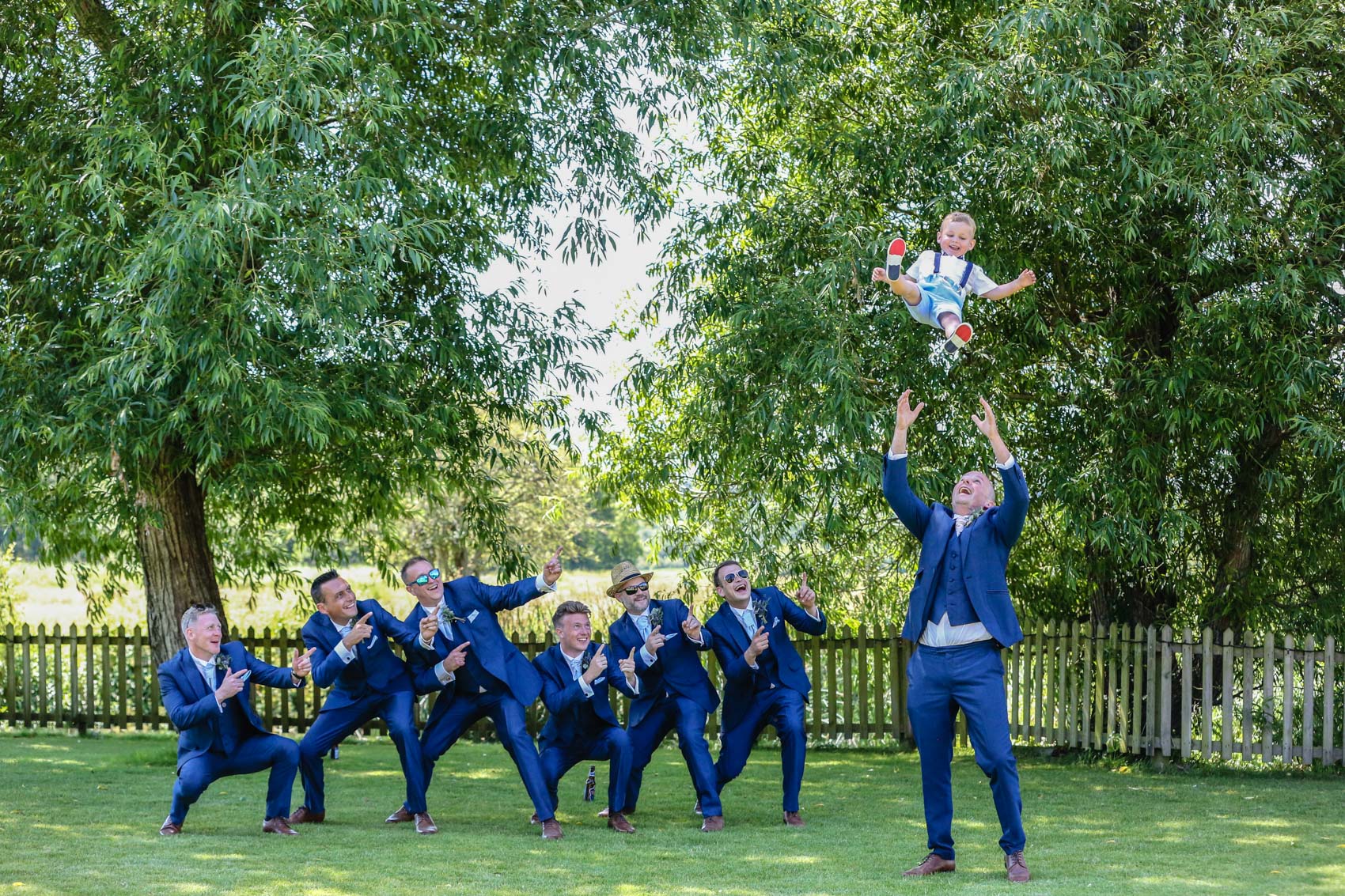 Groom being thrown in the air