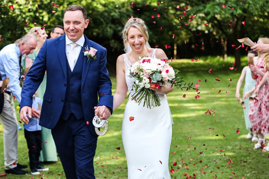 the-old-vicarage-dorset-wedding-ceremony Outdoor wedding ceremony at The Old Vicarage Dorset surrounded by garden greenery